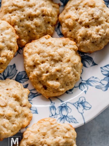 Perfectly baked banana cookies with oatmeal on a blue plate.
