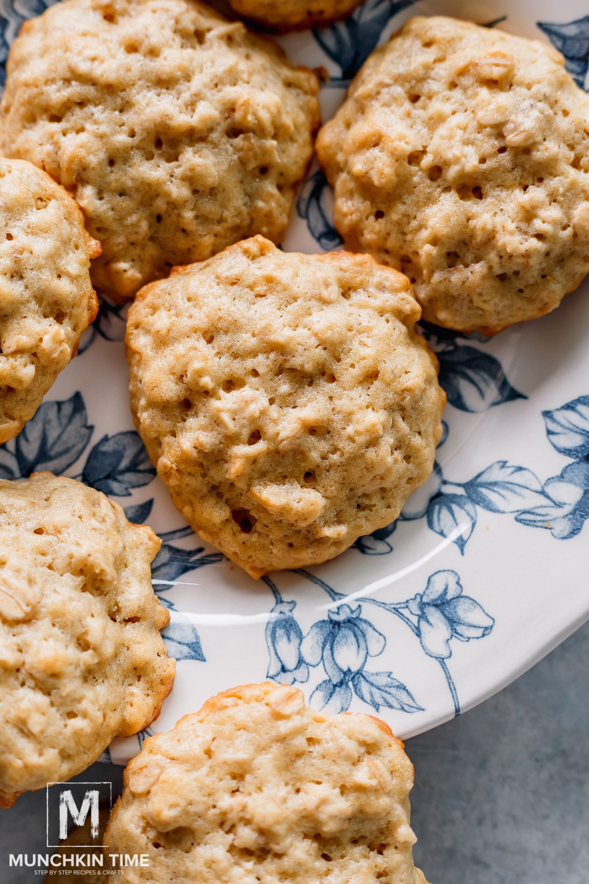 Perfectly baked banana cookies with oatmeal on a blue plate.