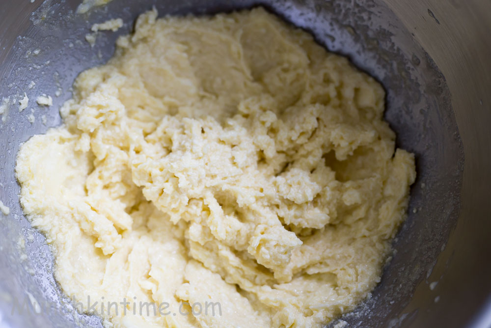 Butter and eggs mixing with sugar.