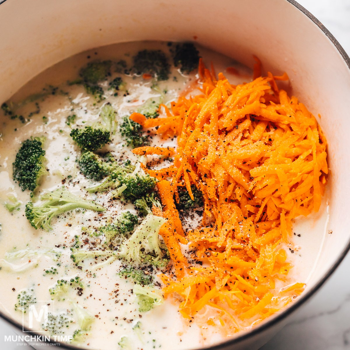 Broccoli, carrot and seasoning is ready for cooking.