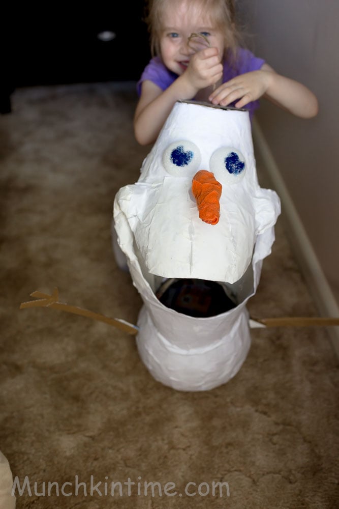 Olaf eyes attached to the piñata.