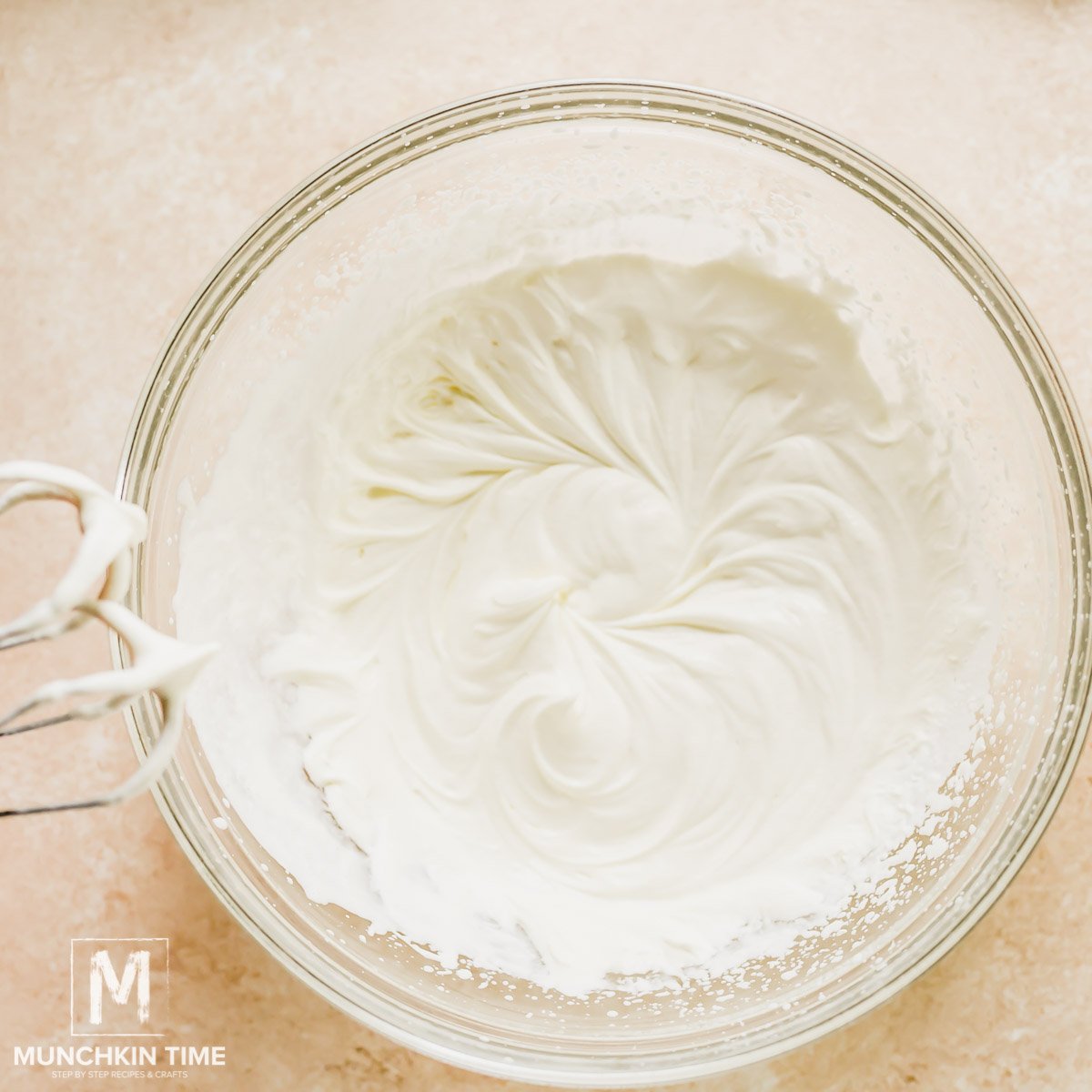 Whipped heavy cream inside the bowl.