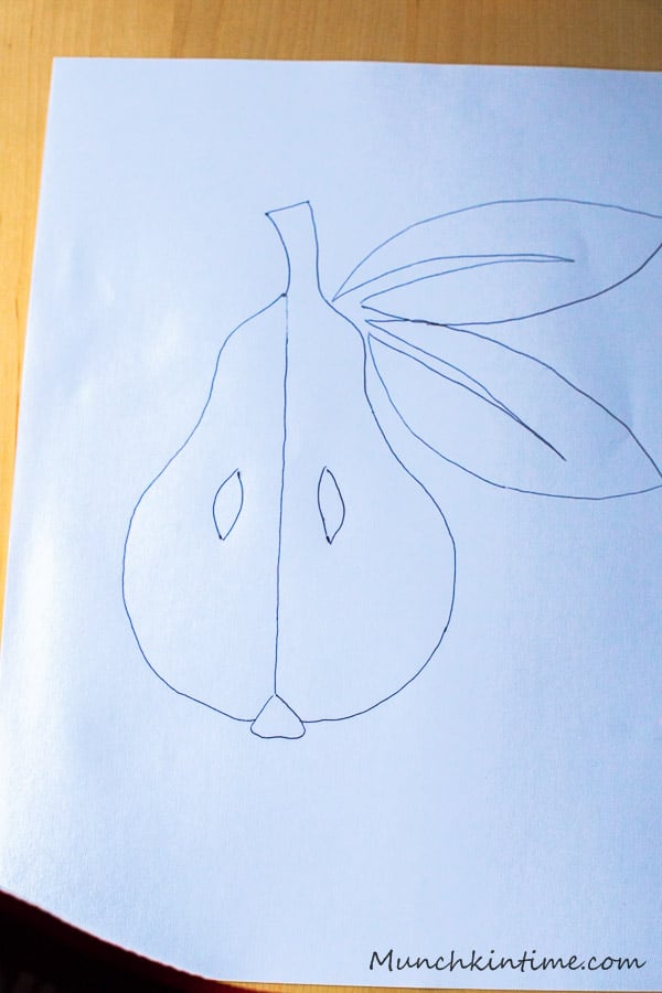A drawing of a pear on a white paper. 