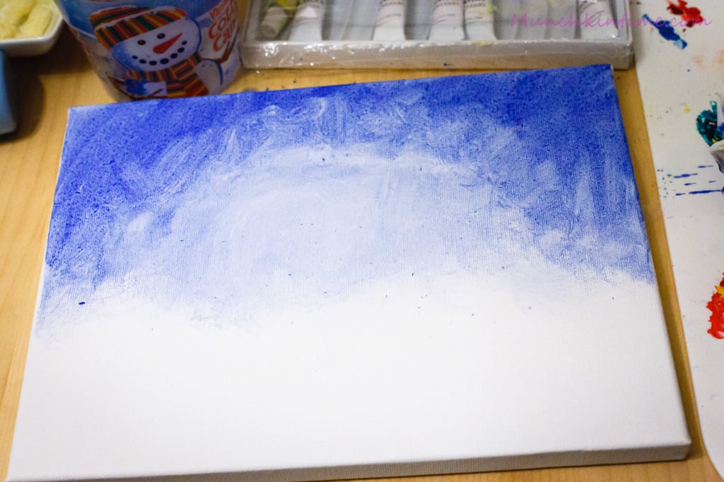 White canvas painted blue for sky.