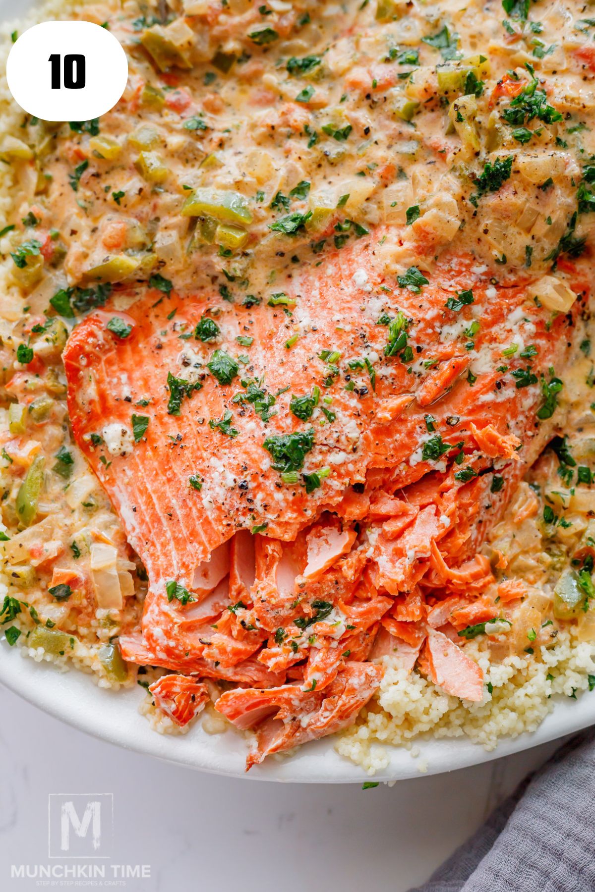 a close up look of flakey Oven Baked Salmon with Couscous