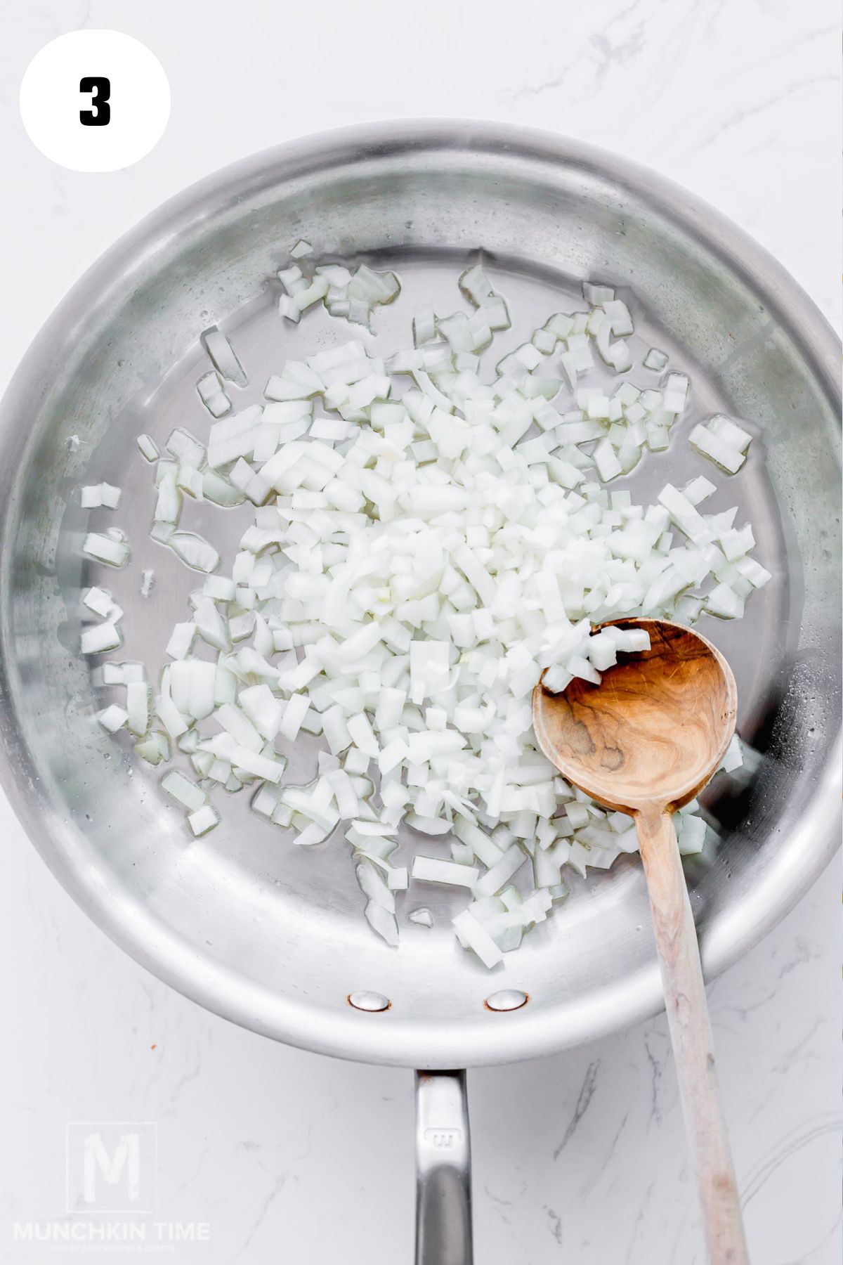 onion added to the large stainless steel skillet.