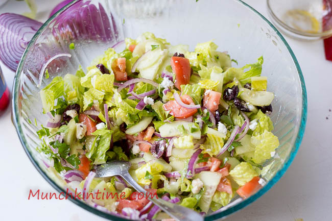 Easy Greek Salad mixed inside the big mixing bowl.