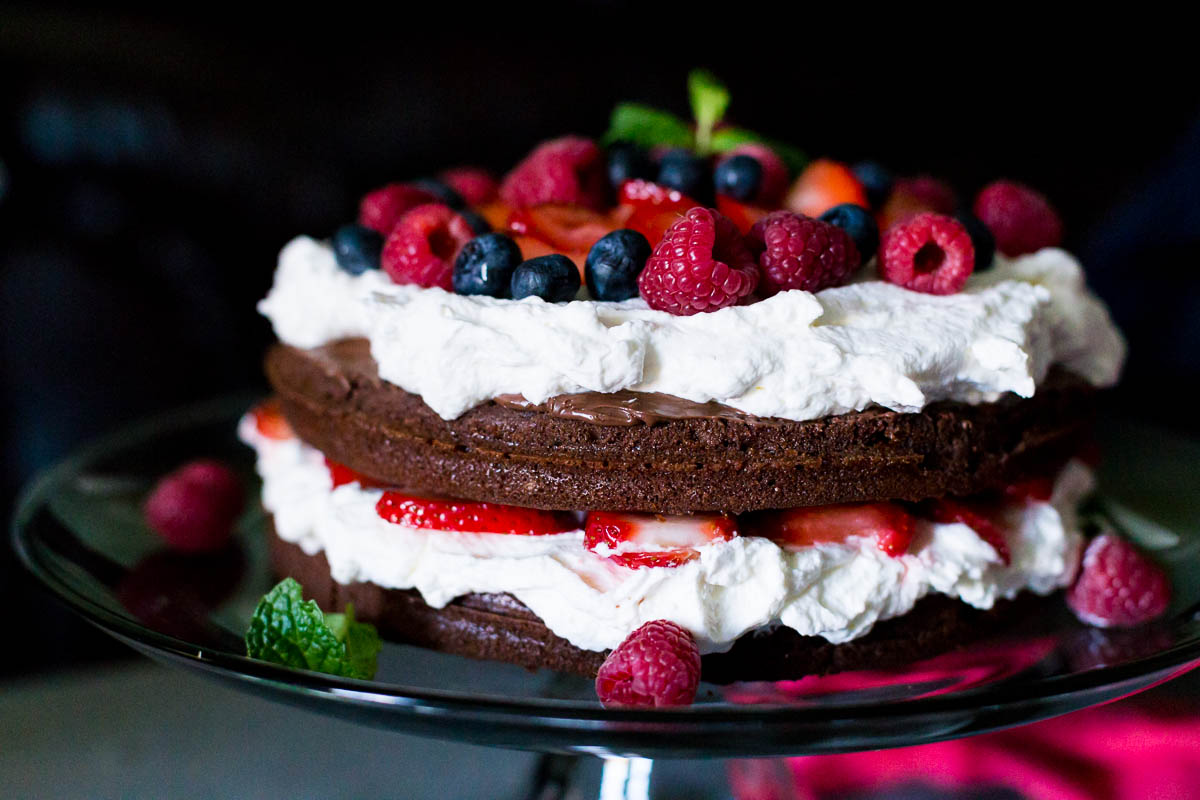 Strawberry Nutella Cake Recipe #chocolatecake #nutella https://www.munchkintime.com/chocolate-nutella-strawberry-cake/