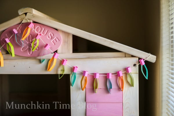 Paper Lights hanging over a tree house inside the kids bedroom.