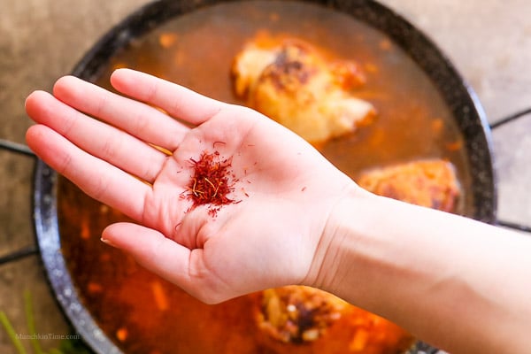 Saffron added into paella.