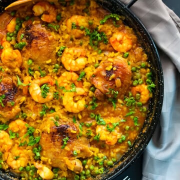 Chicken Thighs and Shrimp Paella Recipe by Love Keil -- www.munchkintime.com #paellarecipe