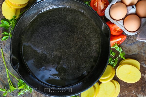 cast iron skillet with ingredients around it