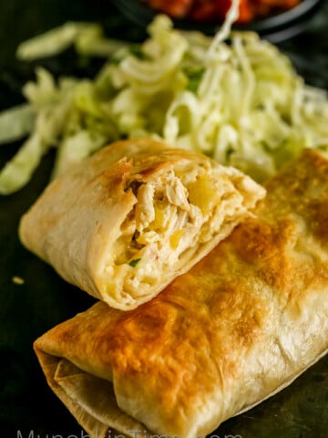 Easy Chicken Chimichanga Recipe made of 5 simple ingredients, perfect Mexican dish dinner idea. #EasyChickenChimichangaRecipe -- www.munchkintime.com-easy-chicken-chimichanga-recipe