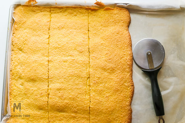 A picture of a baked layer of the cake cut into 3 pieces.