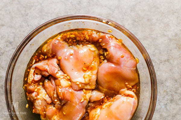 Chicken thighs marinate.