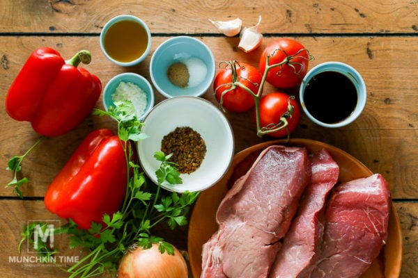 Ingredients laying on a table that you will need to make Pepper Steak.