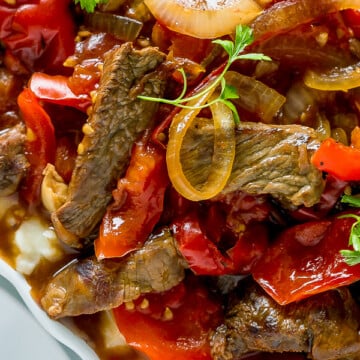 Tender Crock Pot Pepper Steak in amazing thick sauce. Easy dinner recipe for busy moms.