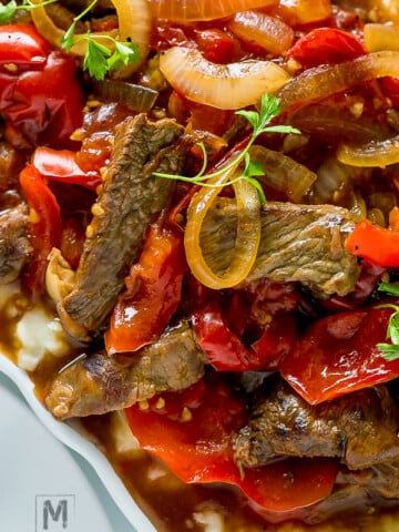 Tender Crock Pot Pepper Steak in amazing thick sauce. Easy dinner recipe for busy moms.