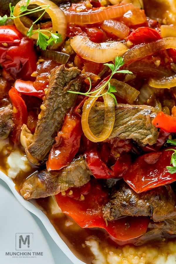 Tender Crock Pot Pepper Steak in amazing thick sauce. Easy dinner recipe for busy moms.