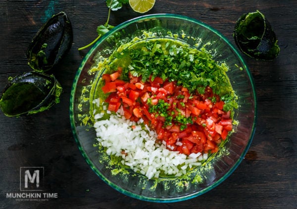 Guacamole Recipe Simple tailgate party food! Made of ripe avocados, jalapeno, tomatoes on the wine, onion, freshly squeezed lime juice and lots of cilantro. Game on baby!