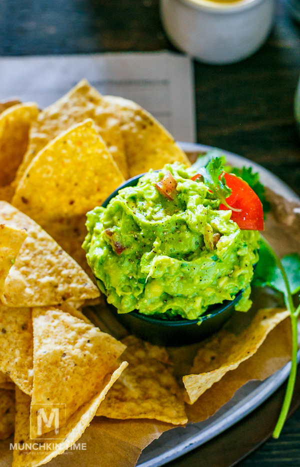 Guacamole Recipe Simple tailgate party food! Made of ripe avocados, jalapeno, tomatoes on the wine, onion, freshly squeezed lime juice and lots of cilantro. Game on baby!