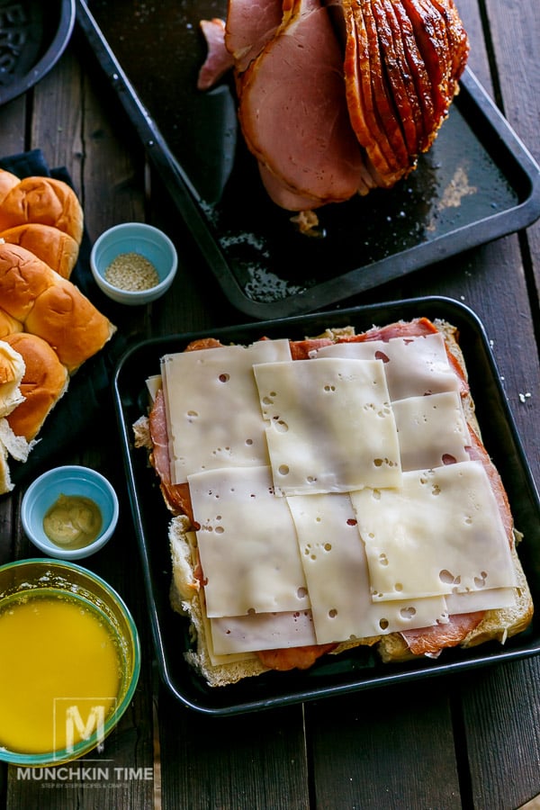 Cheese slices added over the ham.