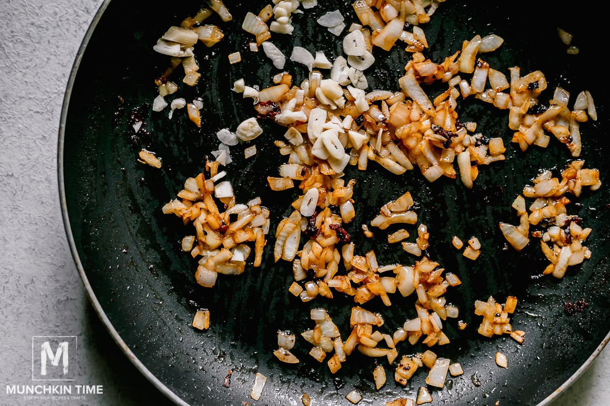 Sautéed onion and garlic inside the skillet.