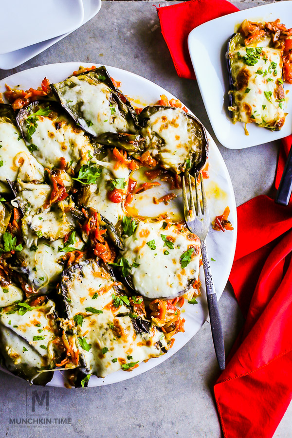 Loaded & Baked Eggplant Recipe - loaded with saute onion, carrots, tomatoes and mozzarella cheese. This eggplant side dish is So Good!!! 