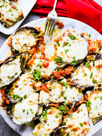 Loaded & Baked Eggplant Recipe - loaded with saute onion, carrots, tomatoes and mozzarella cheese. It's So Good!!!