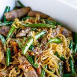 30 Minute Gluten-Free Beef Lo Mein Recipe - this dinner meal is bursting with delicious flavor. Made of Flank steak, crunchy green beans, grated carrot and amazing sauce to complete this Chinese dish. LIKE & Share!
