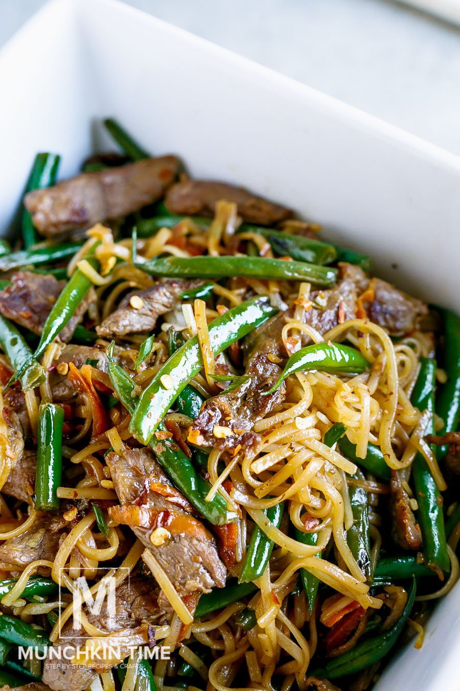 30 Minute Gluten-Free Beef Lo Mein Recipe - this dinner meal is bursting with delicious flavor. Made of Flank steak, crunchy green beans, grated carrot and amazing sauce to complete this Chinese dish. LIKE & Share!