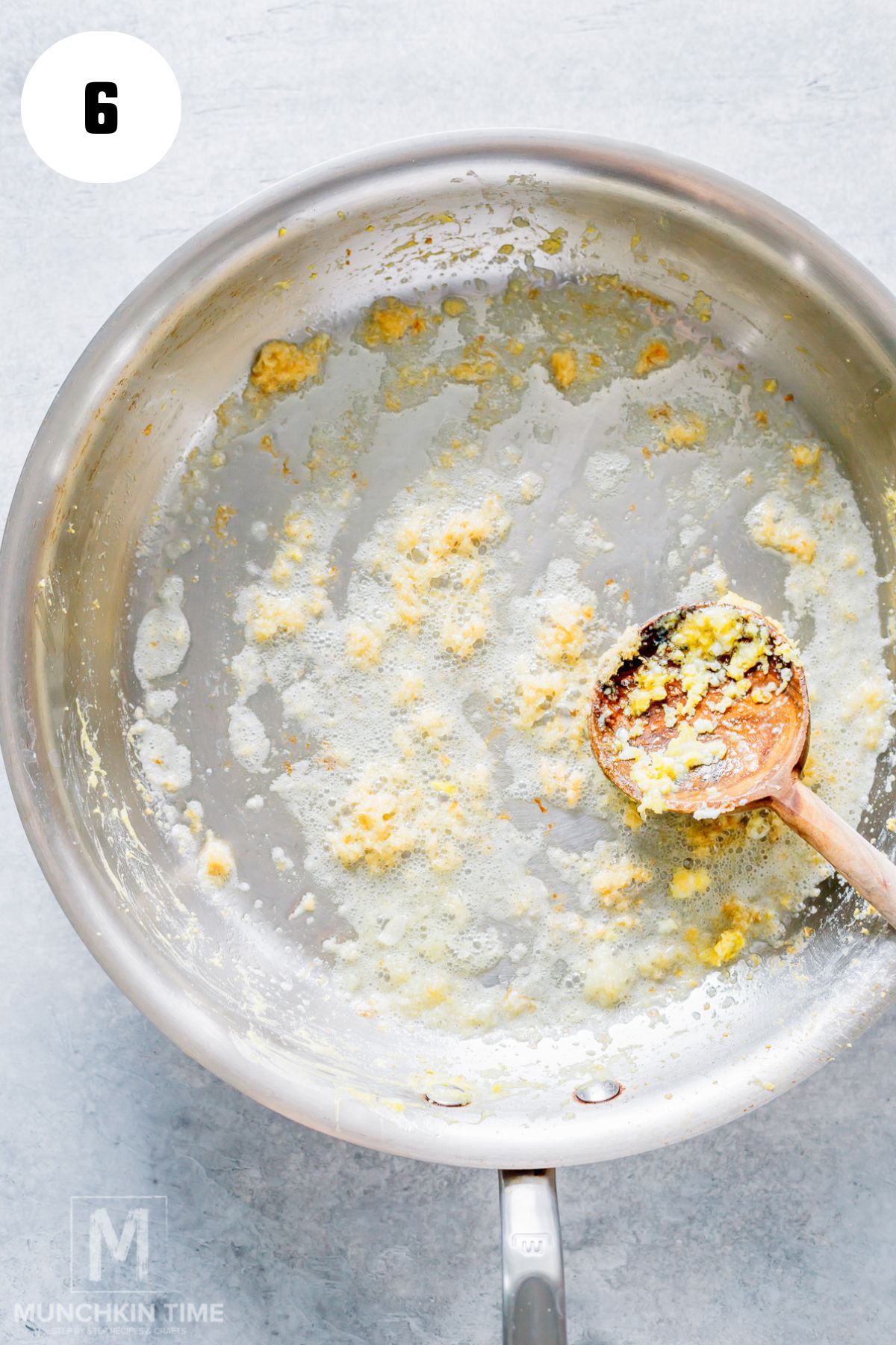 Cooking garlic in oil to start an easy fried rice recipe.