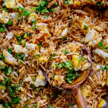 Easy fried rice recipe with egg and green onions served in a bowl.