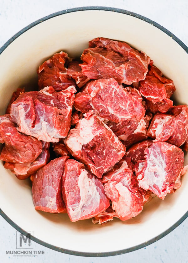 Meat pieces inside the dutch oven. 