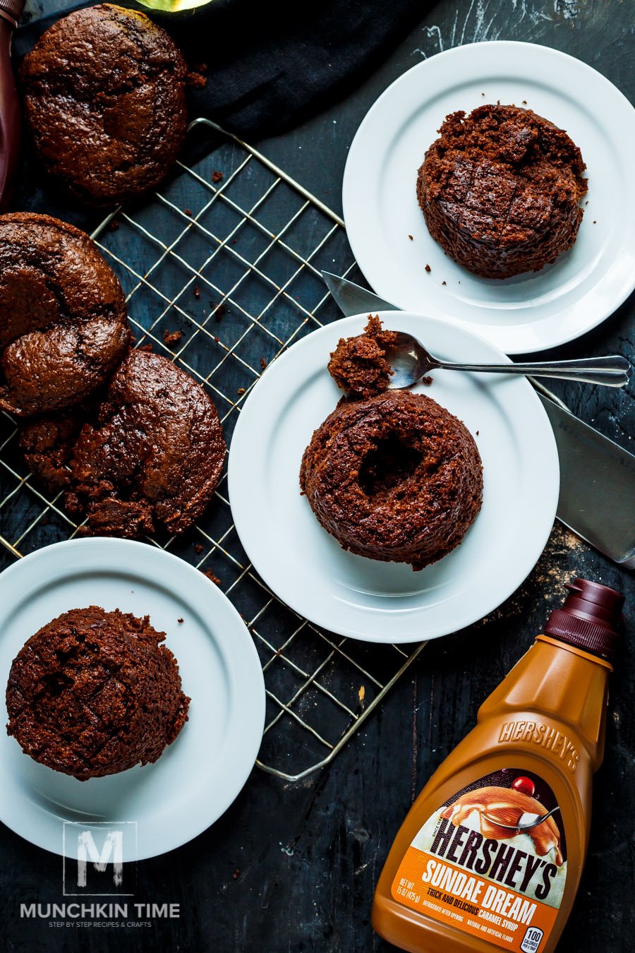 assembling Molten Lava Cake by removing the center of the cake.