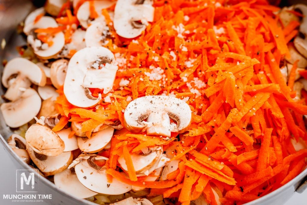 mushrooms and carrots added to the skillet