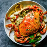 The Best Oven-Roasted Dungeness Crab Recipe: Dungenuss Crab oven roast in garlic butter sauce until perfection.