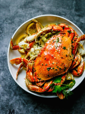 The Best Oven-Roasted Dungeness Crab Recipe: Dungenuss Crab oven roast in garlic butter sauce until perfection.