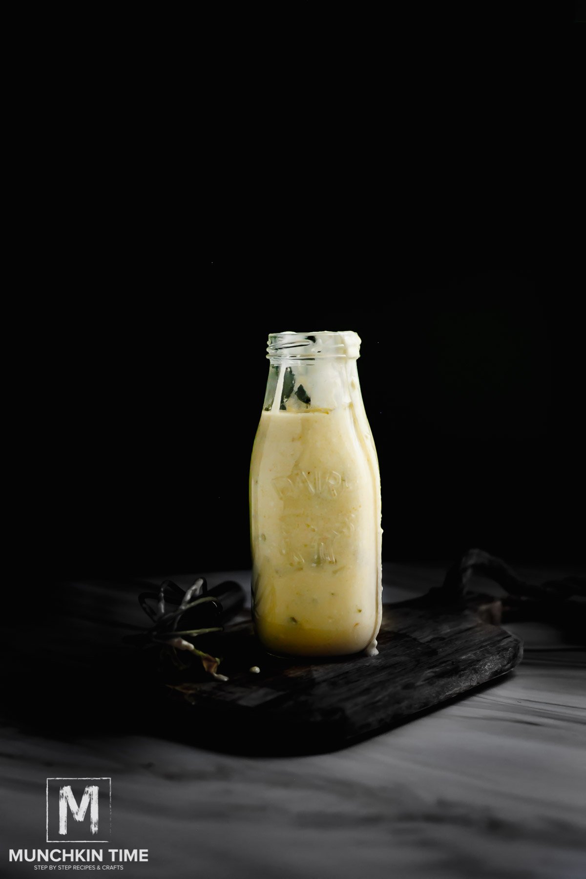 Mexican White Sauce Recipe in a milk jar.
