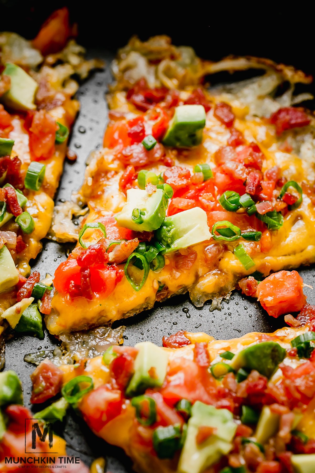 25-Min Cheesy Hash Browns Breakfast Pizza Recipe. Cheesy Breakfast Pizza with hash brown crust.