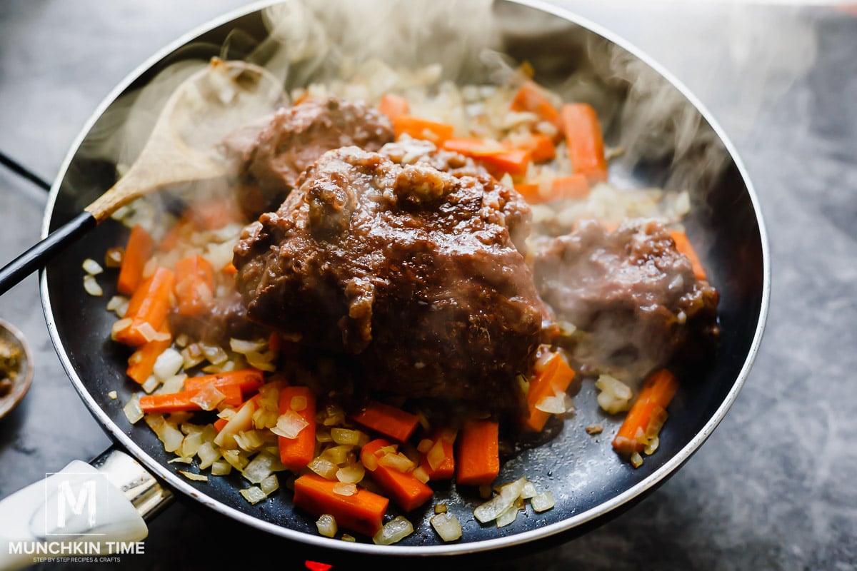 How to make best pot roast recipe? Add Morton's of Omaha Beef Pot Roast and break it apart using wooden spoon.