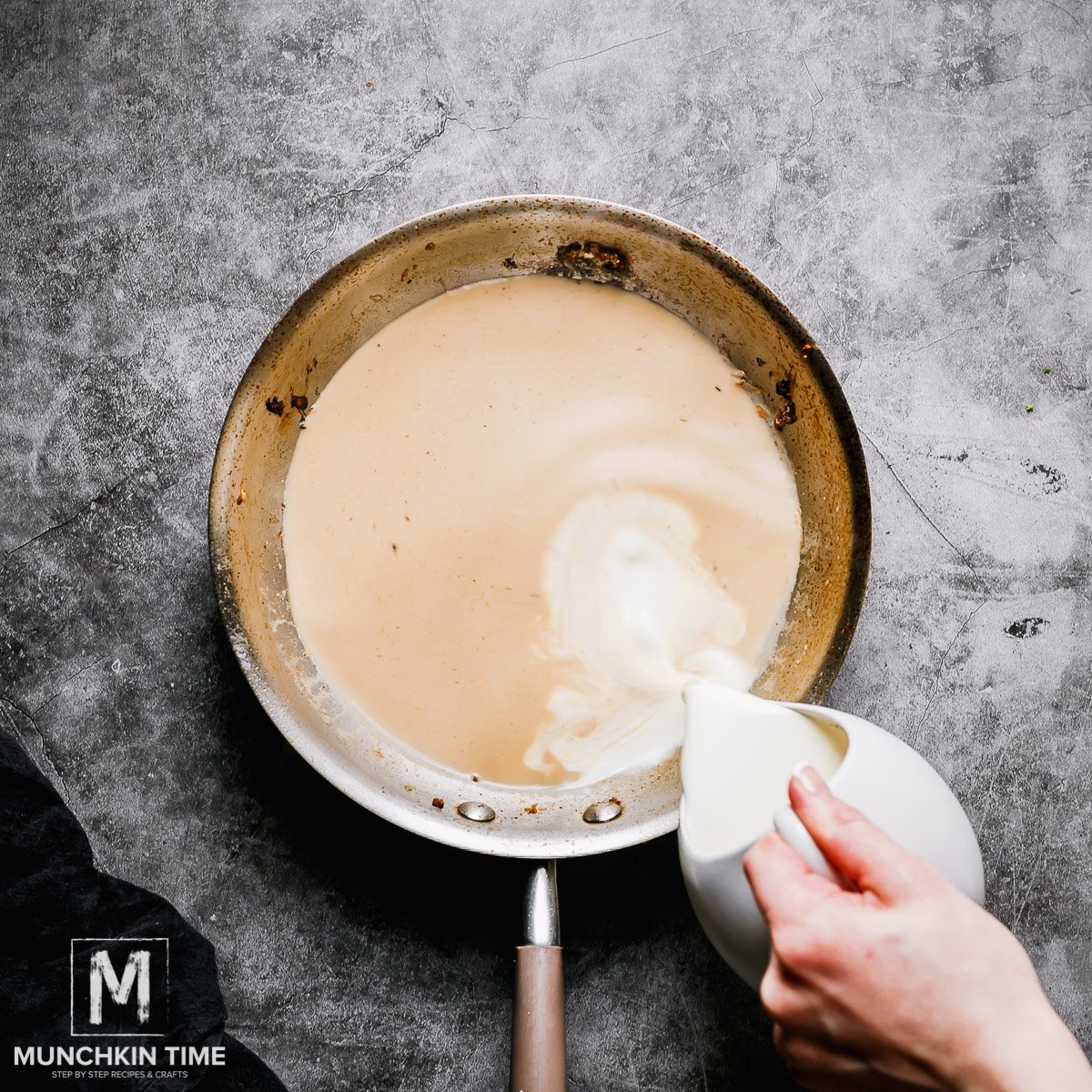 creamy white sauce in the skillet.
