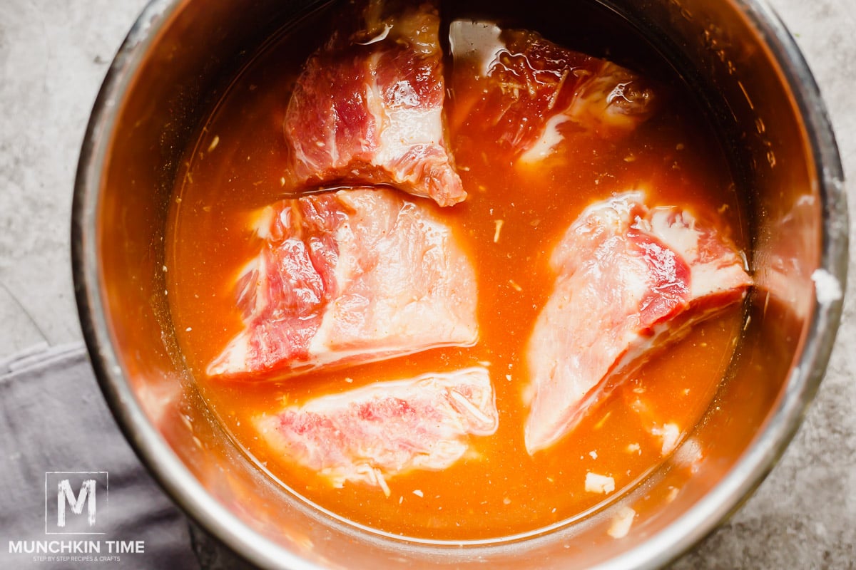 Incredibly juice & fall-off-the-bone baby back ribs braised in amazing liquid inside Instant Pot.