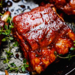 Incredibly juice & fall-off-the-bone baby back ribs braised in amazing liquid inside Instant Pot.