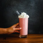 Blend until smooth. Serve in a glass, and garnish with whipped cream. Enjoy!