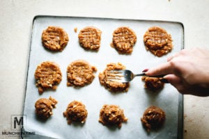 Press on the dough using fork.