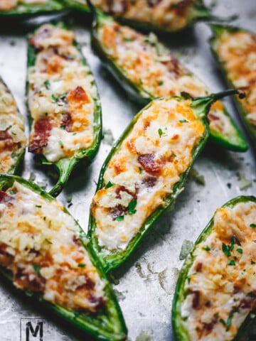 Stuffed jalapeño peppers with cream cheese, bacon & cheddar cheese.