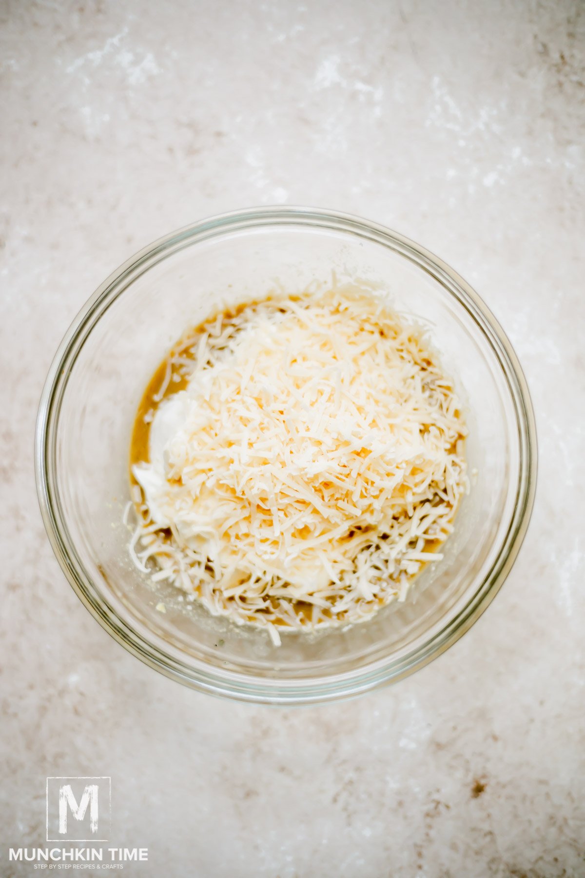  salad dressing ingredients inside the mixing bowl.