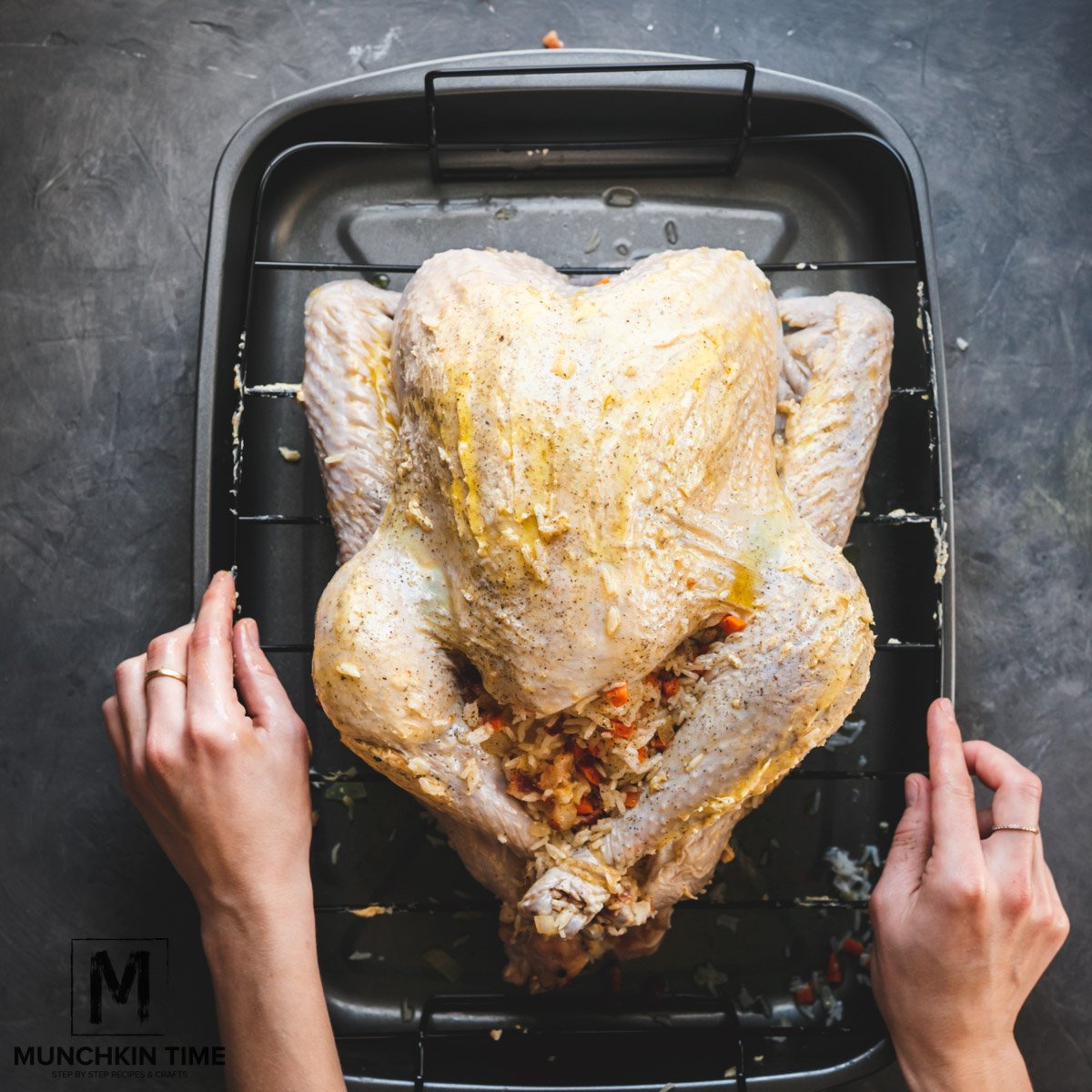 Turkey greased with oil and ready to be placed in a baking bag.