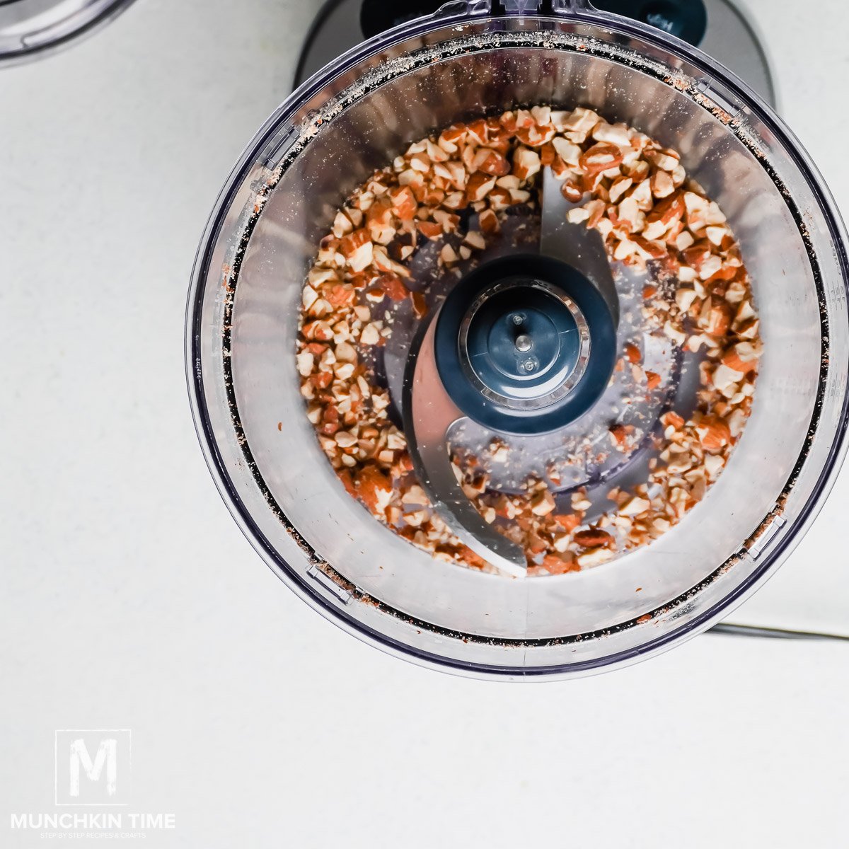 Toasted almonds inside the food processor, pulsed few times. 